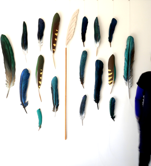 Claire Jensen with feather carvings